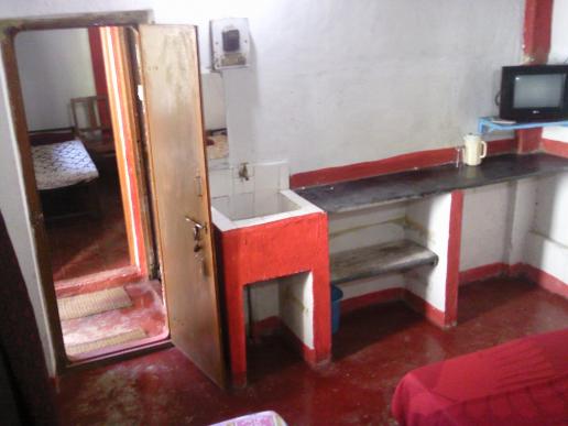 From inside of 3 beded cottage No.3, seen is similar cottage No.4 & in-between toilet